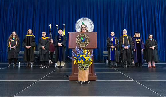 The stage party assembles for the start of Honors Convocation 2024.