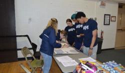 Students assist with registration