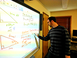 Kevin McAdoo writing on a white board