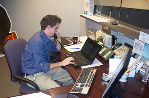 Jeff Lake working the sales phones for the Bridgeport Sound Tigers, Connecticut.