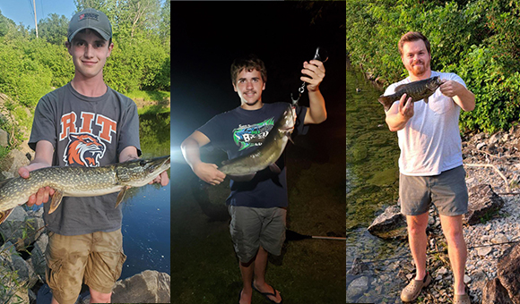 Three Liberty students showcase their large fish catch.