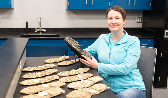 Elizabeth Brown demonstrates her research on casting crime scene footwear impressions in one of the new Dana Hall Classrooms