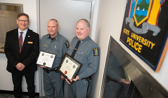 SUNY Canton University Police Chief Alan P. Mulkin congratulating Lieutenants Brian J. Perry and Brian E. Kurish for their recent FBI- Law Enforcement Executive Development Association Trilogy Awards.