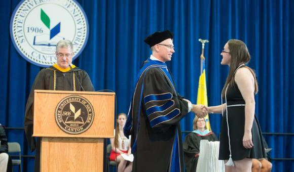 Provost Scheidt shakes Jessica Fischer's hand at last year's Honors Convocation.