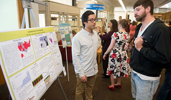 Kyle Matsumoto presents on road salt contamination in the Southworth Library.