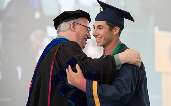 Francesco Palumbo – SUNY Canton President Zvi Szafran embraces Francesco Palumbo, a Sports Management graduate from Canton, as he crosses the stage during commencement.