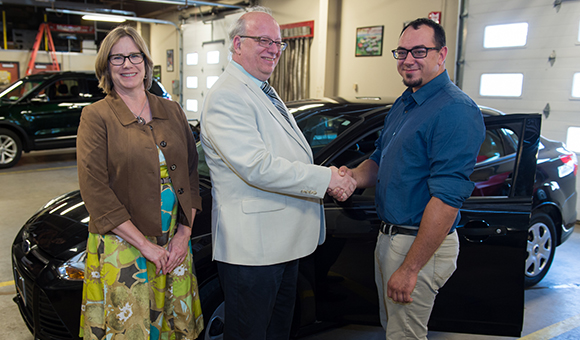 Vice President Anne Sibley stands with President Szafran and Ford Technician Christopher Sysock