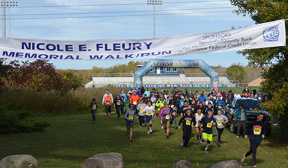 Participants cross the finish line.