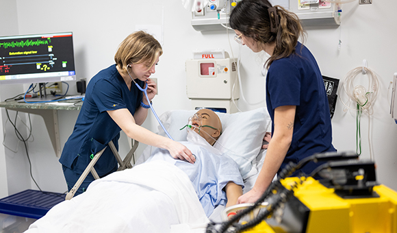 SUNY Canton nursing students practice life-saving techniques in the college's state-of-the-art simulation hospital classroom.