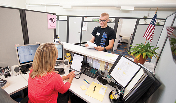 A student receives assistance from the Registrar's Office at the One-Hop Shop
