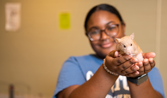 Viktoria and her pet gerbil, Muffin.