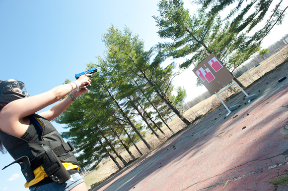 Students practice firearm skills on a mock gun range.