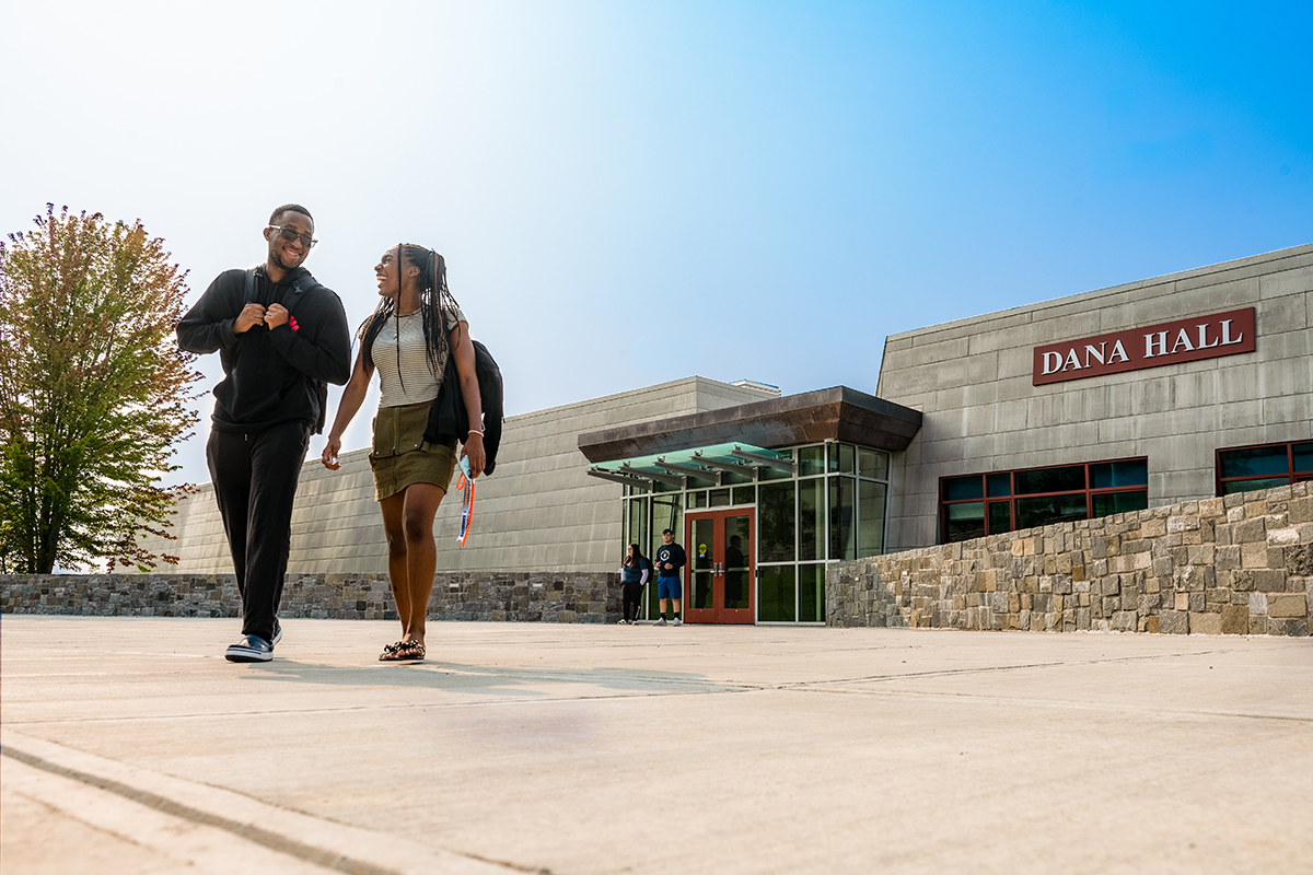 Two students laugh as they depart from the newly renovated Dana Hall.