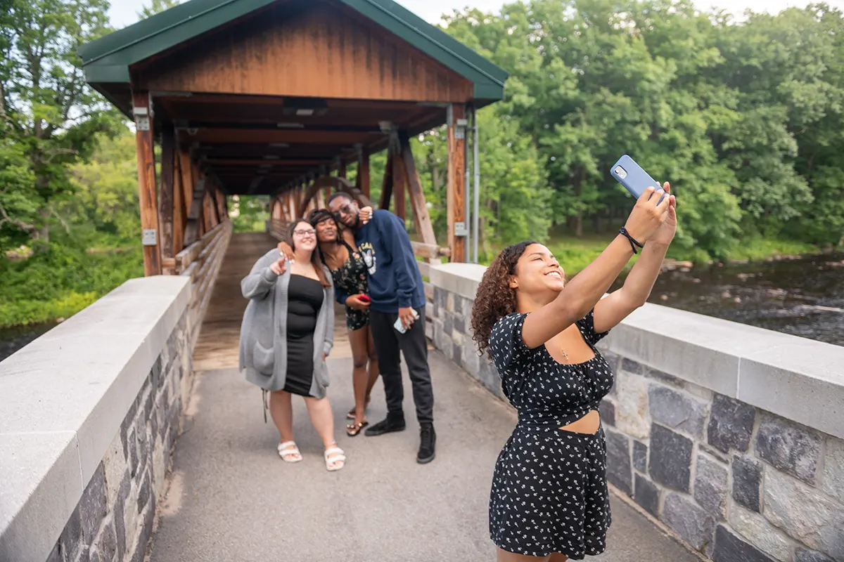 Students pose for a selfie on the footbridges.