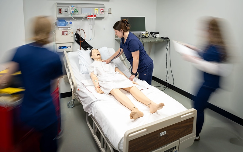 Students work in the Nursing Simulation Lab
