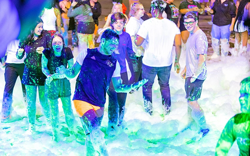Students have fun at a campus foam party.