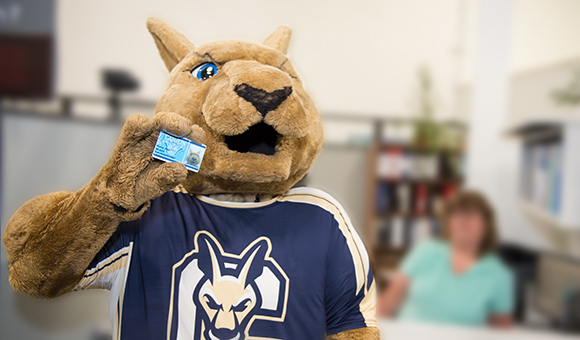 Roody Roo holds up his ID Card.