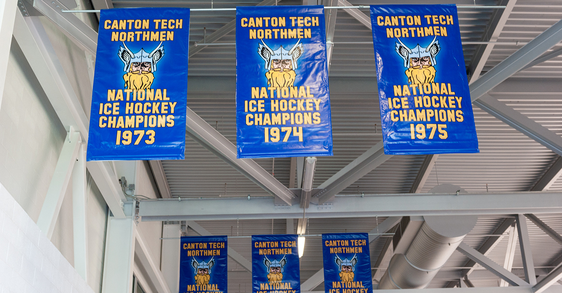 Men's Hockey Championship banners hang in the Roos House Arena