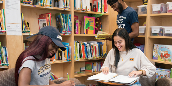 Three students study in the Early Childhood laboratory.