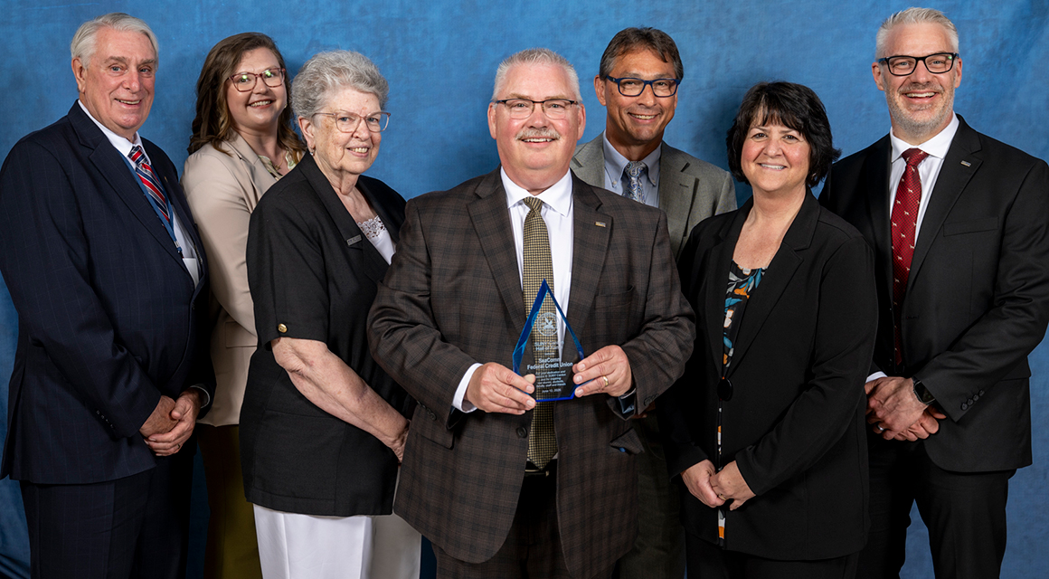 Scott Wilson and staff accept a Hall of Fame award on behalf of SeaComm Credit Union.