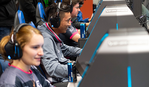 Students playing with SK Gaming in the eSports Arena