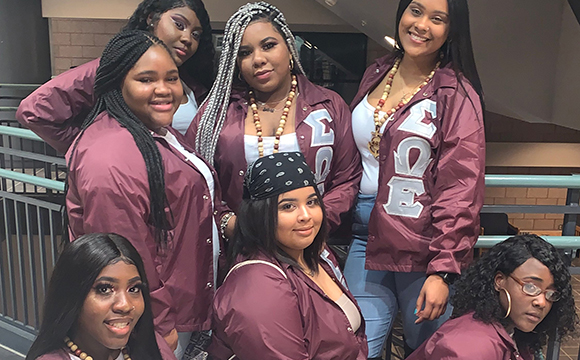 Sigma Omega Epsilon Sorority poses in the Miller Campus Center.