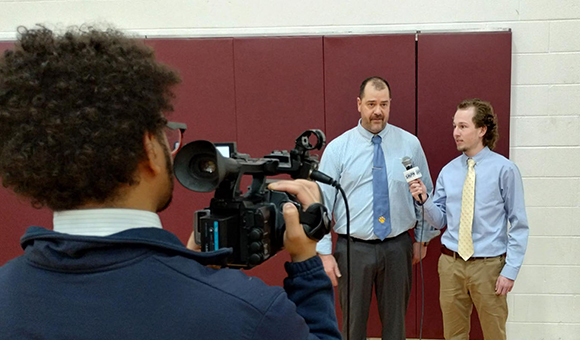 Students interview a Section X girls basketball coach.