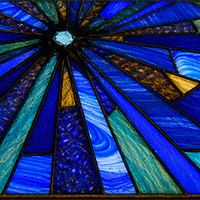 Stained glass with blue and green hues.