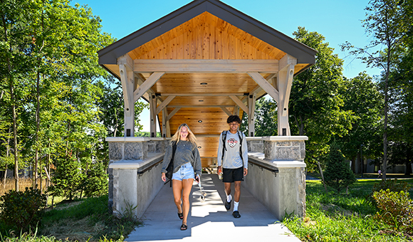 Two students reach the top of one of two new staircases connecting the residence halls to academic classrooms.