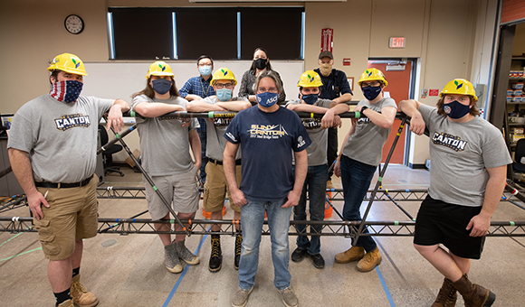 Steel bridge team poses with their regional winning bridge.