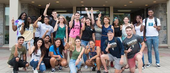 Students of all races, colors and creeds stand together in front of Southworth Library.