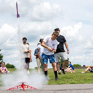 Students launch model rockets during summer camp.