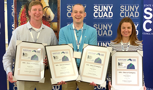 Gregory Kie, Travis Smith and Lorette Murray hold SUNYCUAD Awards