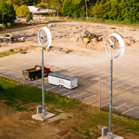 Wind turbines and geothermal well drilling outside French Hall.