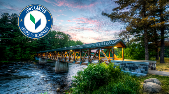 Footbridge at sunset with circle logo