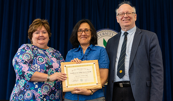 Tess Murphy is awarded by Jenn Stevenson and President Zvi Szafran