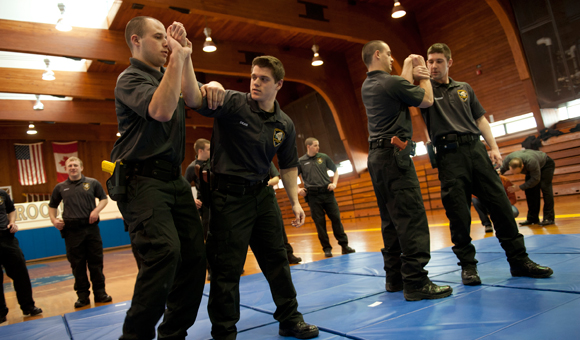 Students training in defense tactics