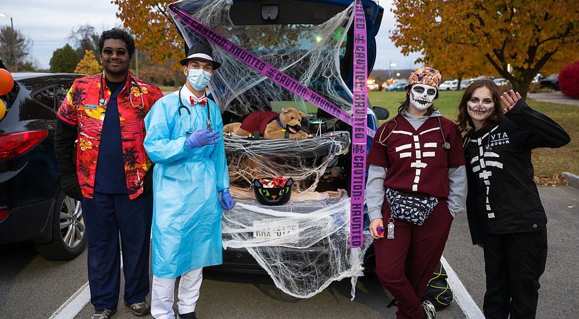 Vet Tech Association students dressed as creepy pet surgeons during Trunk or Treat.