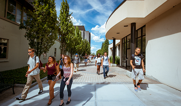 Students walking through the plaza after class.