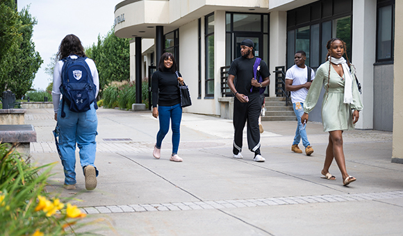 Students walk to classes in the Roselle Plaza.