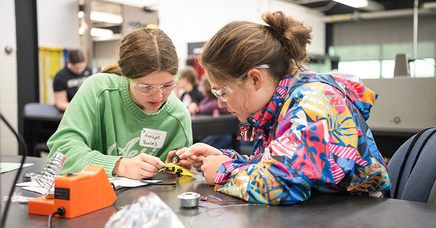 Students work on an electric motherboard.