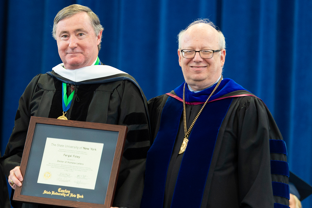 Fergal Foley accepts his Honorary Doctorate from President Szafran.
