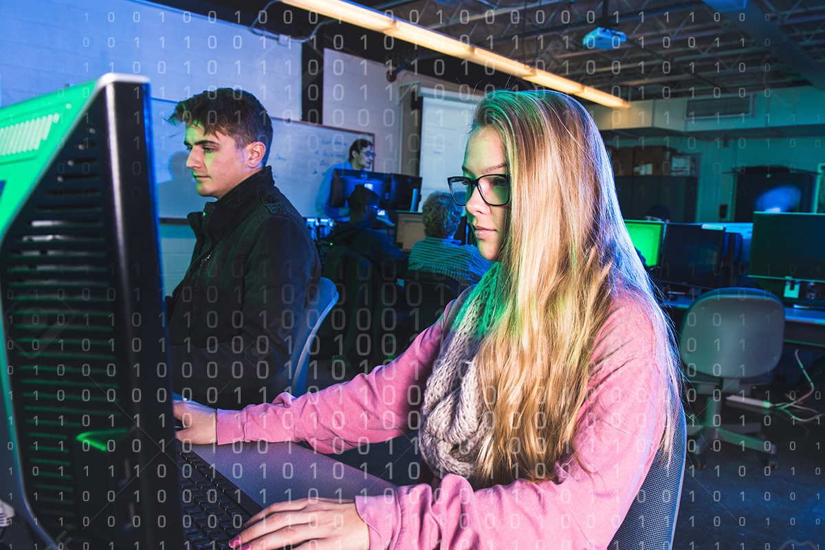 Two students work in the Cybersecurity lab.